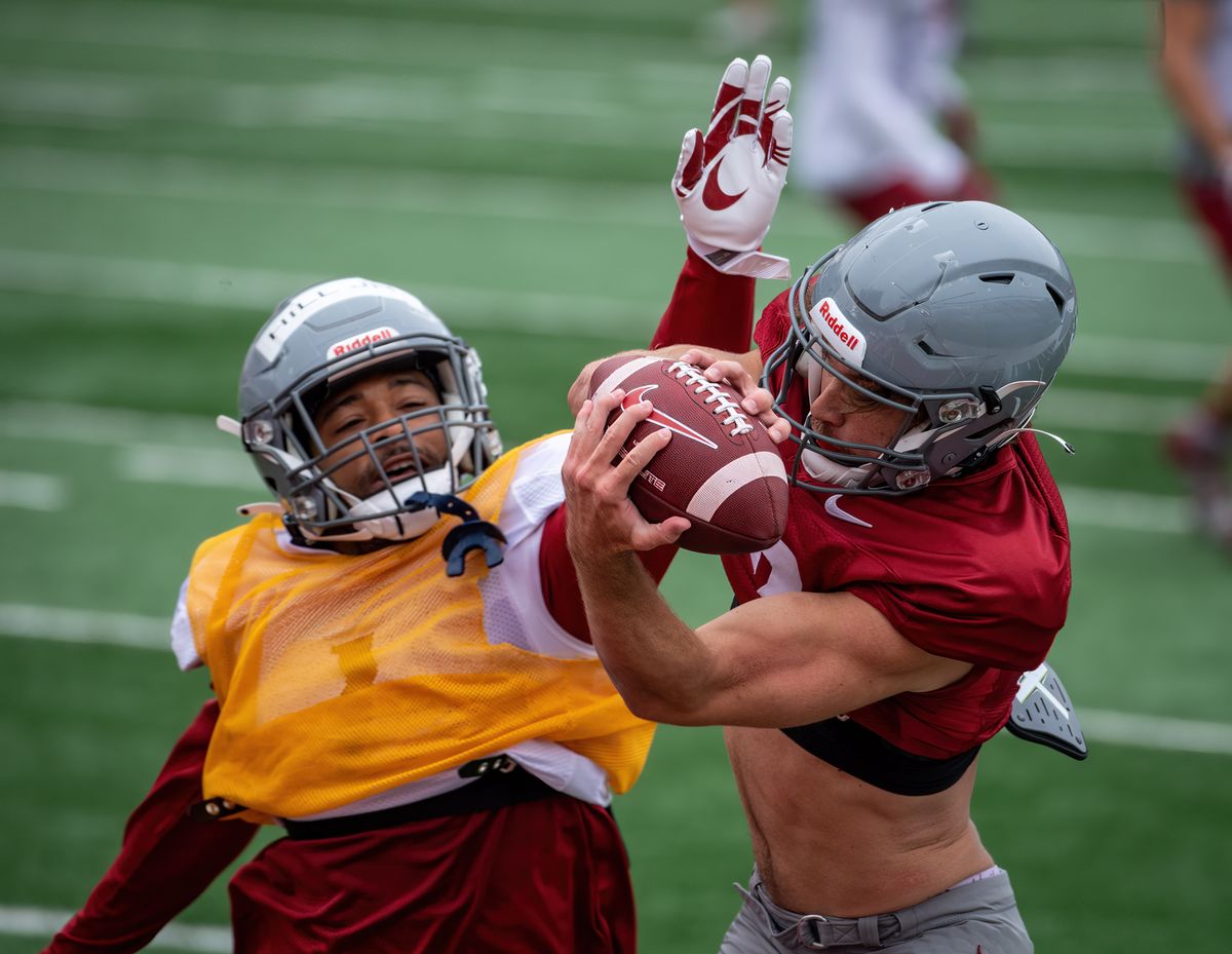WSU wide receiver Joey Hobert hauls in a long pass over WSU defensive back Tyrone Hill Jr. during a mini-scrimmage and practice at Gesa Field in Pullman, Wash., Saturday, August 21, 2021.  (COLIN MULVANY/THE SPOKESMAN-REVIEW)