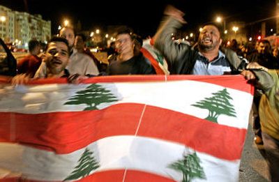 
Lebanese supporters of slain former Lebanese Prime Minister Rafik Hariri chant slogans during a gathering for prayers Friday in Beirut. The gathering came one day after a U.N. report implicated Syria in Hariri's assassination. 
 (Associated Press / The Spokesman-Review)