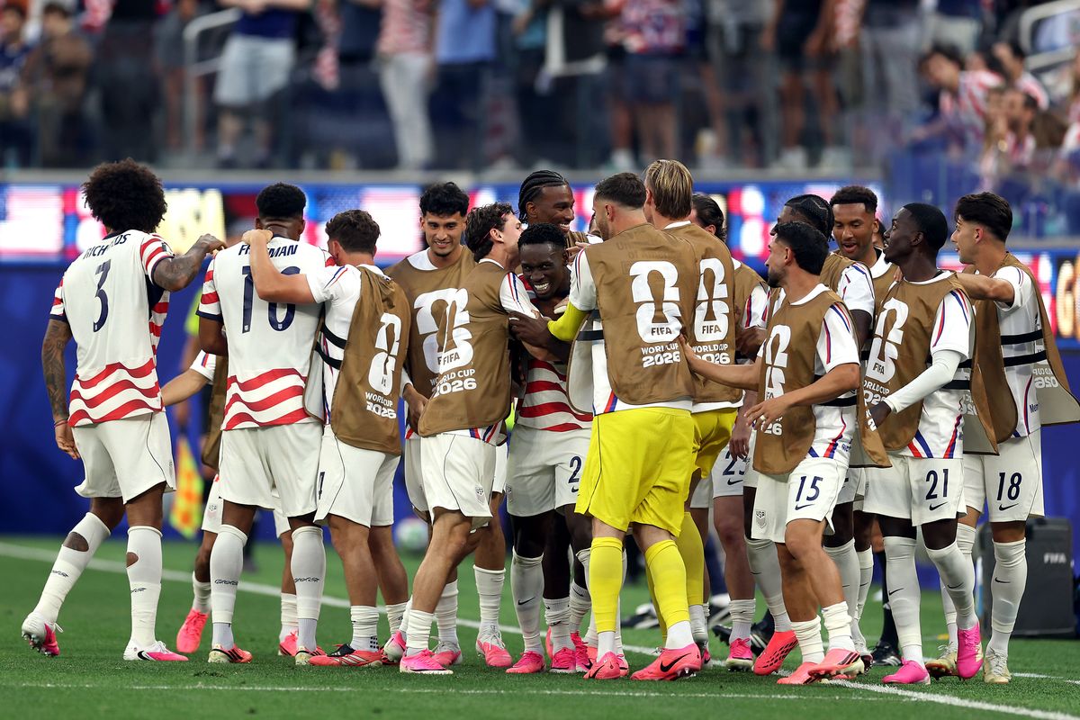 United States players mob around Folarin Balogun after he scored against Paraguay on June 12 in Inglewood, Calif.  (Getty Images)