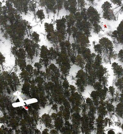 
Billings pilot Alan Kasemodel circles over Andrew Scheffer, top right,  whose plane crashed in the Pryor Mountains  in Montana on Tuesday. Associated Press
 (Associated Press / The Spokesman-Review)