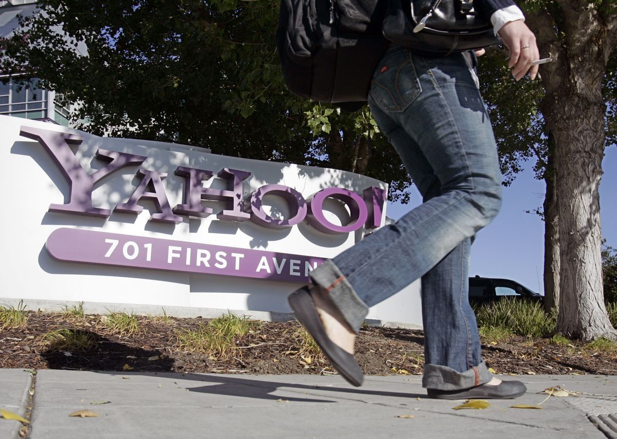 A worker walks near Yahoo headquarters in Sunnyvale, Calif. Yahoo’s shares have slumped since rejecting Microsoft’s takeover offer.  (Associated Press / The Spokesman-Review)