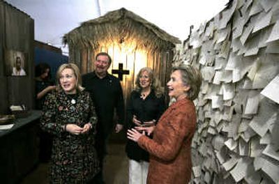 
Democratic presidential hopeful, Sen. Hillary Rodham Clinton, talks with Kay and Rick Warren, left, and Elizabeth Styffe, director of the HIV/AIDS Initiative in the prayer room in a AIDS exhibit at the Global Summit on AIDS and The Church at Saddleback Church in Lake Forest, Calif.
 (Associated Press / The Spokesman-Review)