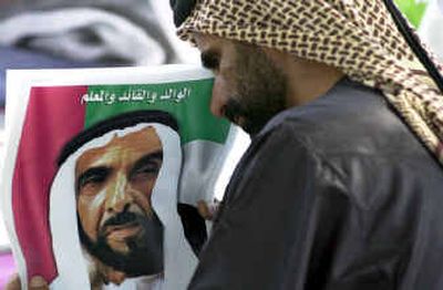 
A man holds a picuture of United Arab Emirates President Sheik Zayed bin Sultan Al Nahyan, who died Tuesday, as he waits for his funeral in Abu Dhabi on Wednesday. A man holds a picuture of United Arab Emirates President Sheik Zayed bin Sultan Al Nahyan, who died Tuesday, as he waits for his funeral in Abu Dhabi on Wednesday. 
 (Associated PressAssociated Press / The Spokesman-Review)