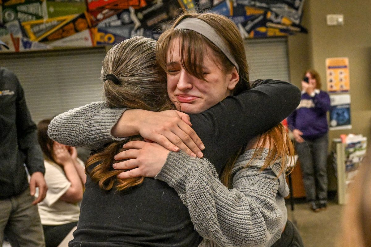 Rogers High School senior Emma Coleman hugs her mother, Erin Anderson, Friday as she realizes that she has been accepted to the University of Washington with the Presidential Scholarship during a presentation at Rogers.  (Kathy Plonka/THE SPOKESMAN-REVIEW)