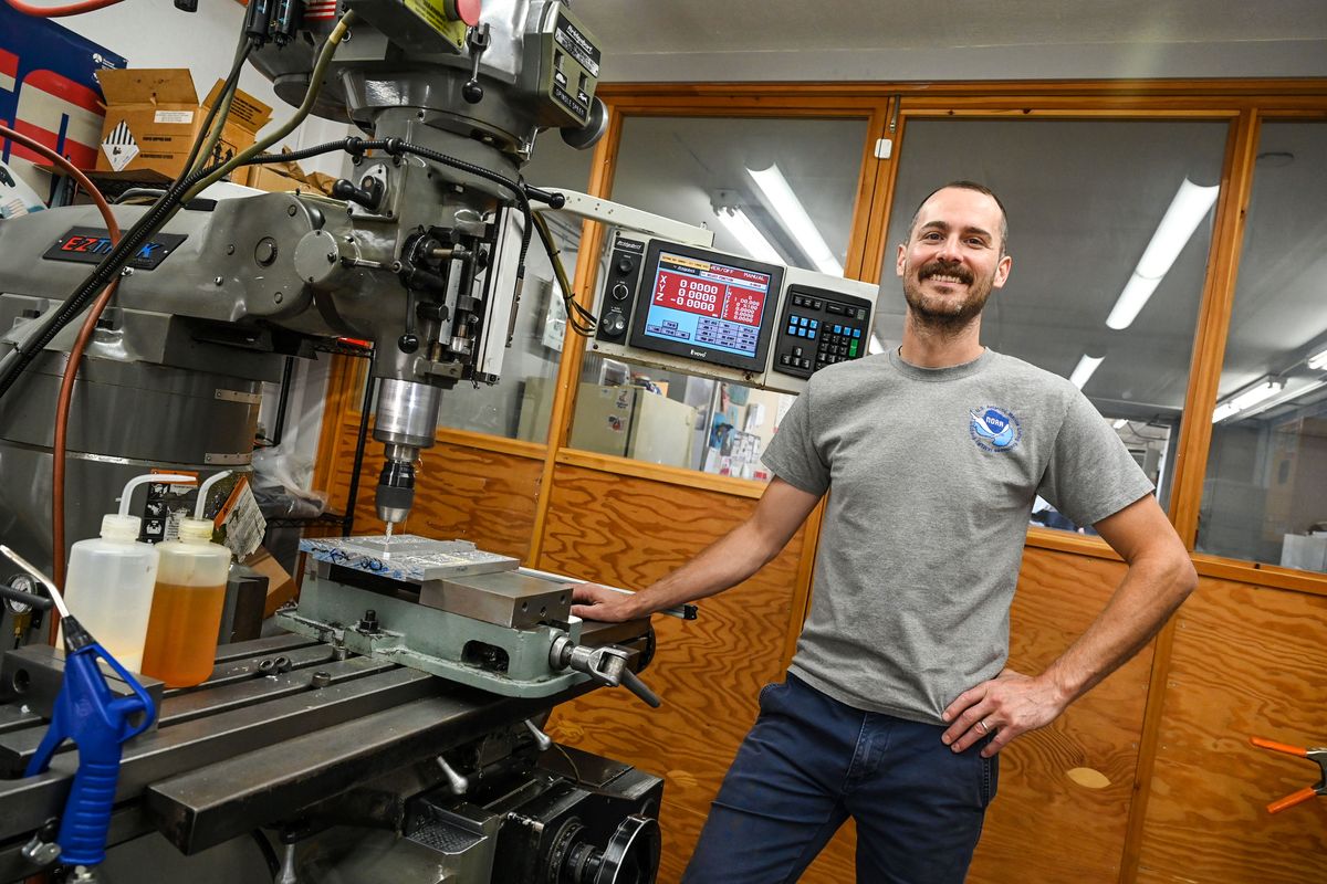 Rob Millsap, of Williamson & Associates Subsea Engineering, is shown with a similar Bridgeport milling machine he learned on at age 17. The machine produces prototype parts for the subsea camera systems.  (DAN PELLE/THE SPOKESMAN-REVIEW)