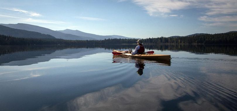 Upper Priest Lake rewards kayaker Kerry Whitsitt with peaceful mid-September solitude after she paddled up the Thorofare from the main Priest Lake, in this Sept. 19, 2016 photo. The Idaho Board of Water Resources is considering changes at Priest Lake including improvements to the Thorofare and alterations to the Outlet Dam, aimed at improving lake levels and river flows. (Bob Drzymkowski)