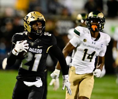 Colorado Buffaloes safety Shilo Sanders returns an interception for a touchdown against Colorado State on Saturday in Boulder, Colo.  (Denver Post)