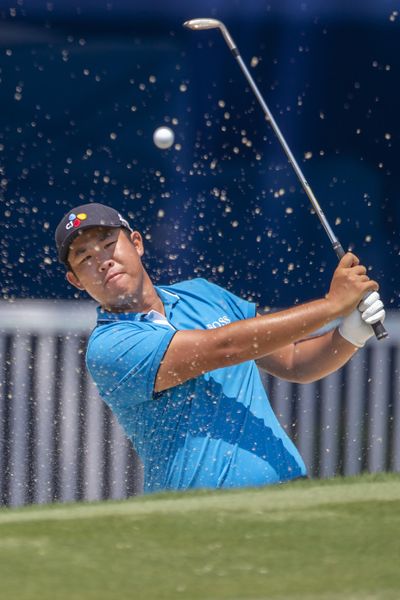 Byeong Hun An, of South Korea, hits from a sand trap on the 18th hole during the first round of the Wyndham Championship golf tournament in Greensboro, N.C., Thursday, Aug. 1, 2019. (H. Scott Hoffmann / News & Record)