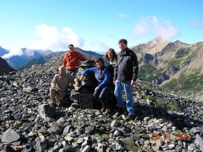 
This photo provided by Peter Durnford shows, from left, Bernie Schiesser, Don McTighe, Sherry Durnford, Gail Thurber and Garth Thurber with a plaque honoring Reginald Thurber at the site where his aircraft crashed  in the Canadian Rockies in 1968. 
 (Associated Press / The Spokesman-Review)