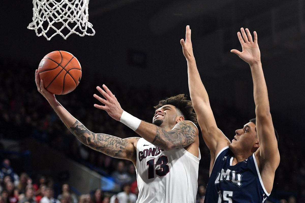 Gonzaga guard Josh Perkins (13) heads to the basket as Loyola Marymount guard Joe Quintana (15) defends during the first half of a college basketball game, Thurs., Jan. 17, 2019, at the McCarthey Athletic Center. (Colin Mulvany / The Spokesman-Review)