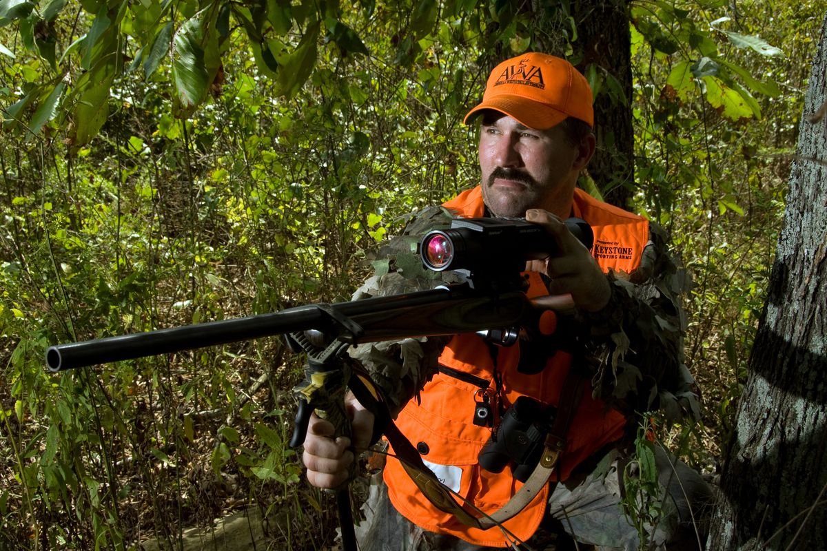 The Elcan DigitalHunter is a rifle scope that records video of what the hunter sees as he aims and shoots. It’s being used in a pioneering “shoot-and-release” whitetail deer competition in which hunters fire blanks and are scored for what the judges see in the video after the hunt. Pictured is Carl Chism, former rodeo bare-bronc riding champ and Whitetail Pro Series contestant from Oklahoma. 