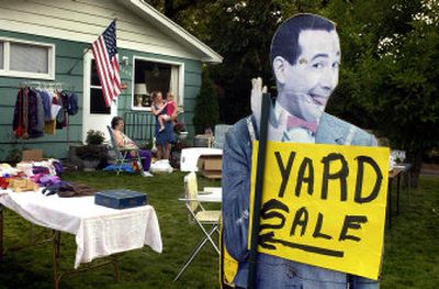 
Pee Wee helps pull in the customers during a garage sale. 
 (File/ / The Spokesman-Review)