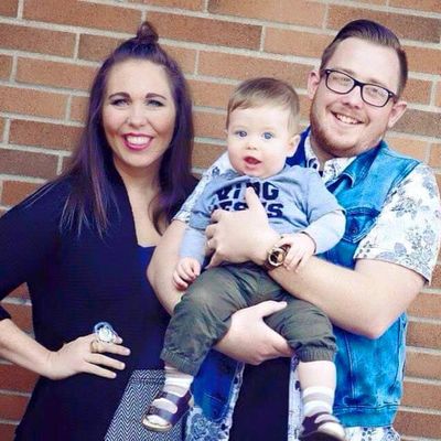 In this undated photo provided by Pastor James Ludlow, Josh and Vanessa Ellis pose with their son Hudson at the EastPointe Foursquare Church in Bonney Lake, Wash., where the couple served as youth pastors. All three were killed Monday when a concrete slab fell from a highway overpass, crushing their vehicle as they drove under it. (Associated Press)