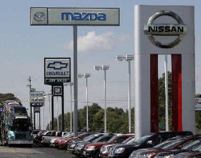 
An automall in Batavia, Ohio, sells Nissan, Mazda, and General Motors vehicles. Executives representing all three automakers met in Paris on Wednesday and agreed to continue discussions on a possible three-way global car making alliance.  
 (Associated Press / The Spokesman-Review)