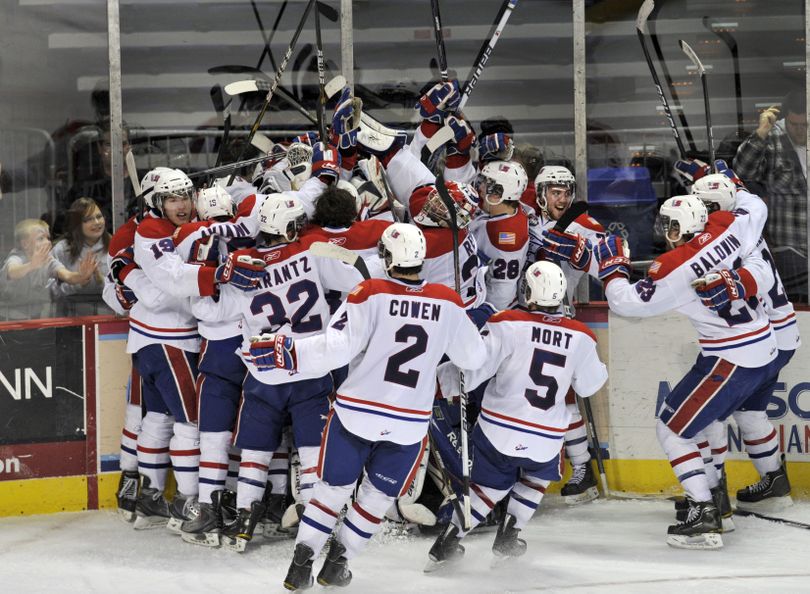 Spokane Chiefs celebrate their game-winning goal in overtime to beat the Tri-City Americans in the Spokane Arena on April 19. (Colin Mulvany)