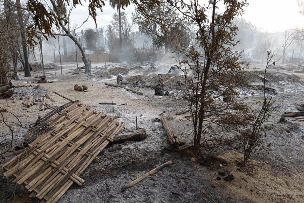 Smoke rises from smoldering houses in Kinma village, Pauk township, Magwe division, central Myanmar on Wednesday, June 16, 2021. Residents said people are missing after military troops burned the village the night before.  (STR)