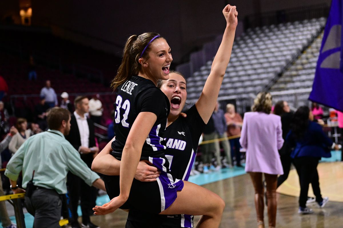 Portland Pilots guard Maisie Burnham (24) hoists guard Kelsey Lenzie (32) after they defeated the Gonzaga Bulldogs during the second half of a WCC tournament championship basketball game on Tuesday, March 7, 2023, at the Orleans Arena in Las Vegas, Nev. The Portland Pilots won the game 63-60.  (Tyler Tjomsland/The Spokesman-Review)