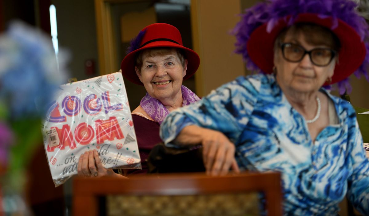 Marcia Macholl displays her winning prize after a trivia contest Thursday during a meeting of the Spokane Valley Red Hots (not Red Hats) at the Spokane Valley Senior Center at CenterPlace Regional Event Center in Spokane Valley. The City Council last week discussed the possibility of moving the senior center.  (Kathy Plonka/The Spokesman-Review)