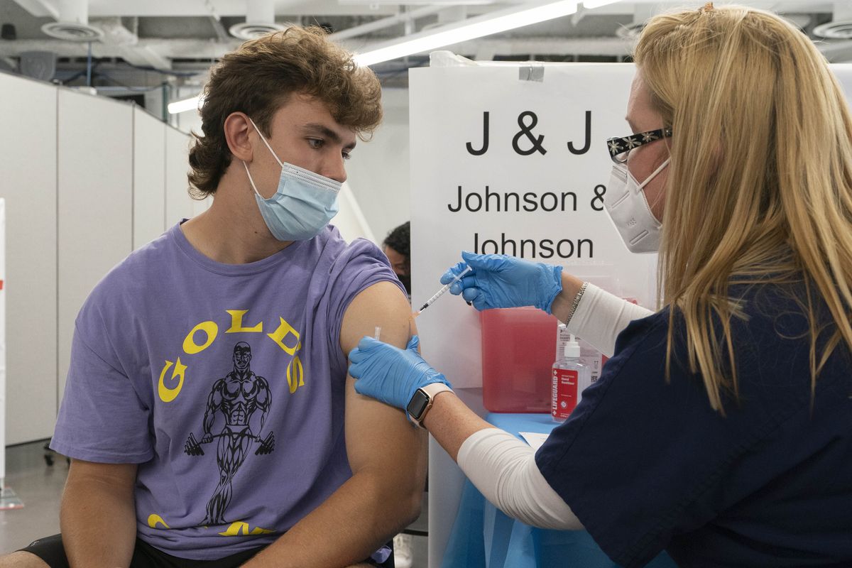 Bradley Sharp, of Saratoga, N.Y., gets the Johnson & Johnson vaccine from registered nurse Stephanie Wagner on July 30 in New York.  (Mark Lennihan)