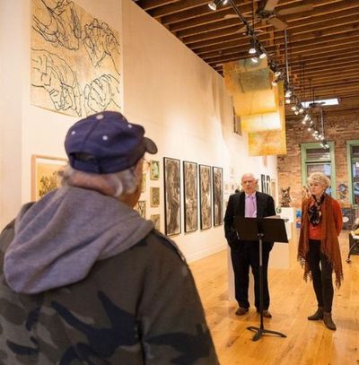 Sandy Patano, far right, and Tony Stewart speak to a group Friday at the Art Spirit Gallery during a press conference to address what they call a political attack on Coeur d’Alene City Councilman Ron Edinger. (Shawn Gust / Coeur d'Alene Press)