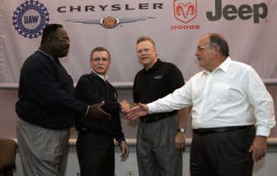 
From left, United Auto Workers vice president General Holiefield, UAW President Ron Gettelfinger, Chrysler Group CEO Tom LaSorda and John Franciosi, DaimlerChrysler's senior vice president for employee relations, shake hands to open the 2007 contract talks at the Chrysler Group headquarters in Auburn Hills, Mich., on Friday. Associated Press
 (Associated Press / The Spokesman-Review)