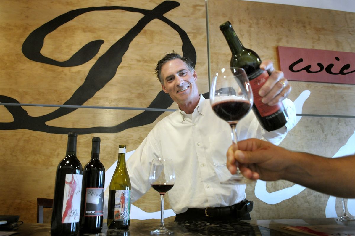 Jack Kammer pours a taste of cabernet for Tom Shaw in the DaMa wine tasting room on Main Street in Walla Walla.  (CHRISTOPHER ANDERSON / The Spokesman-Review)