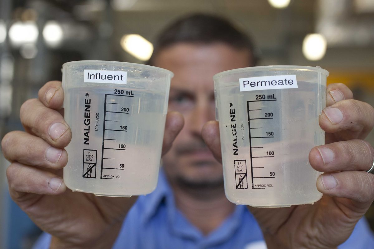 In this photo taken Thursday, Sept. 13, 2012,  Robert James of the California American Water company looks over water samples at a desalination plant in Sand City, Calif.  Not long ago, the idea of squeezing salt from the ocean to make clean drinking water was embraced warmly in thirsty California with its cycles of drought and growing population. But it has not panned out the way many hoped. Desalination plants are costing more to build; they're huge energy suckers and lingering concerns about the impact to marine life have spurred myriad lawsuits. (Eric Risberg / Associated Press)