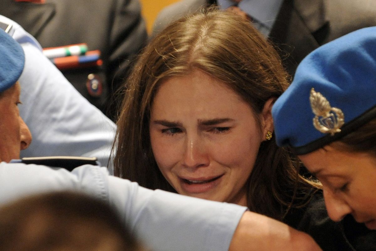 Amanda Knox cries at the Perugia court in Italy on Monday after hearing the verdict that overturned her conviction and acquitted her of murdering Meredith Kercher, her British roommate. (Associated Press)