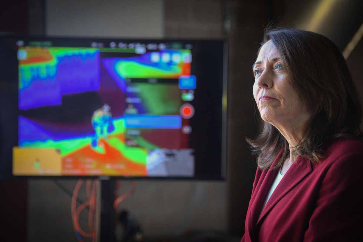 U.S. Sen. Maria Cantwell, D-Wash., demonstrates thermal images from a Spokane Fire Department drone used to scout out and map wildfires, on Wednesday, March 20, 2019, at the department’s training center near Spokane Community College. She joined fire and health experts to tout legislation that requires drones and GPS technology for wildland firefighters. (Dan Pelle / The Spokesman-Review)