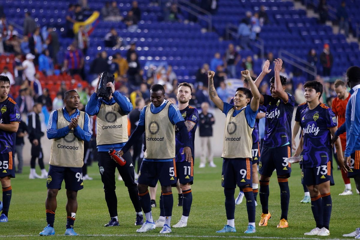 Seattle Sounders celebrate after a 1-1 tie against New York City FC during the second leg of a CONCACAF Champions League soccer semifinal Wednesday, April 13, 2022, in Harrison, N.J. The Sounders won 4-2 on aggregate.  (Associated Press)