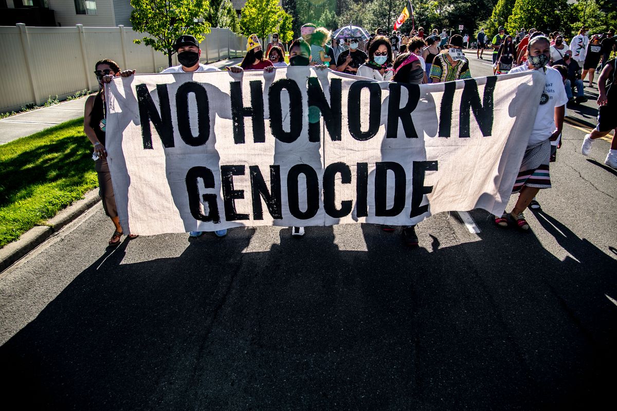 About 150 protesters marched east on Fort George Wright Drive on Saturday, advocating to change the name of the Spokane road that many Native Americans find offensive.  (Colin Mulvany/THE SPOKESMAN-REVIEW)