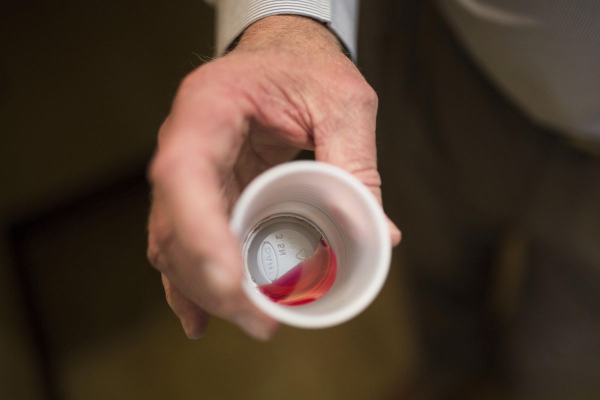In this March 7, 2017, file photo, Paul “Rip” Connell, CEO of Private Clinic North, a methadone clinic, shows a 35 mg liquid dose of methadone at the clinic in Rossville, Ga. (Kevin D. Liles / Associated Press)