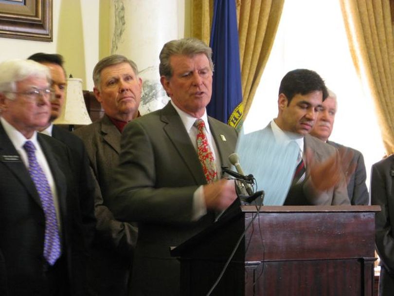 Gov. Butch Otter holds his first public bill-signing ceremony of the session Wednesday, for the 