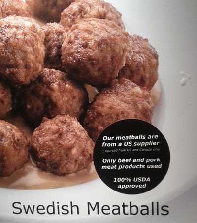 An in-store poster advertisement at the Ikea store in Canton, Mich., on Wednesday shows a newly placed sticker referring to the source of the meatballs served at the cafeteria in the store. (Associated Press)