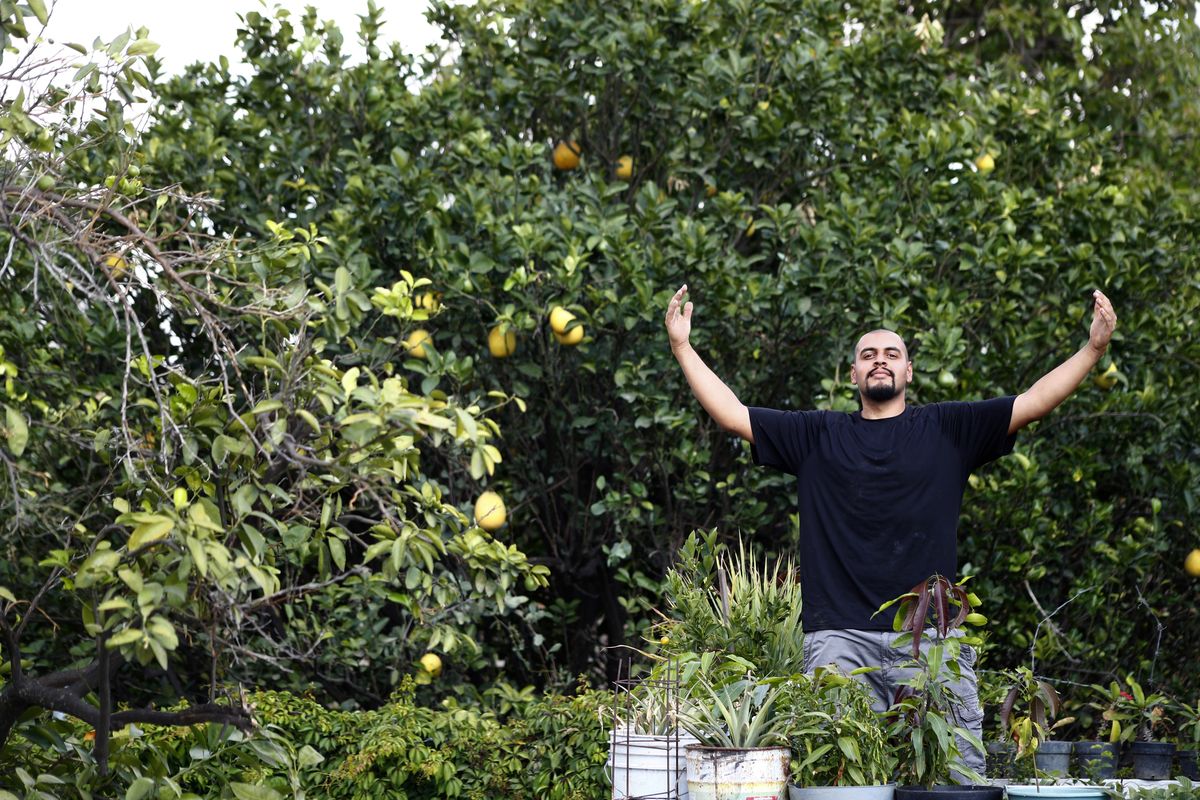 Jesus Lopez, who was deported from the U.S. in 2020, poses at his family