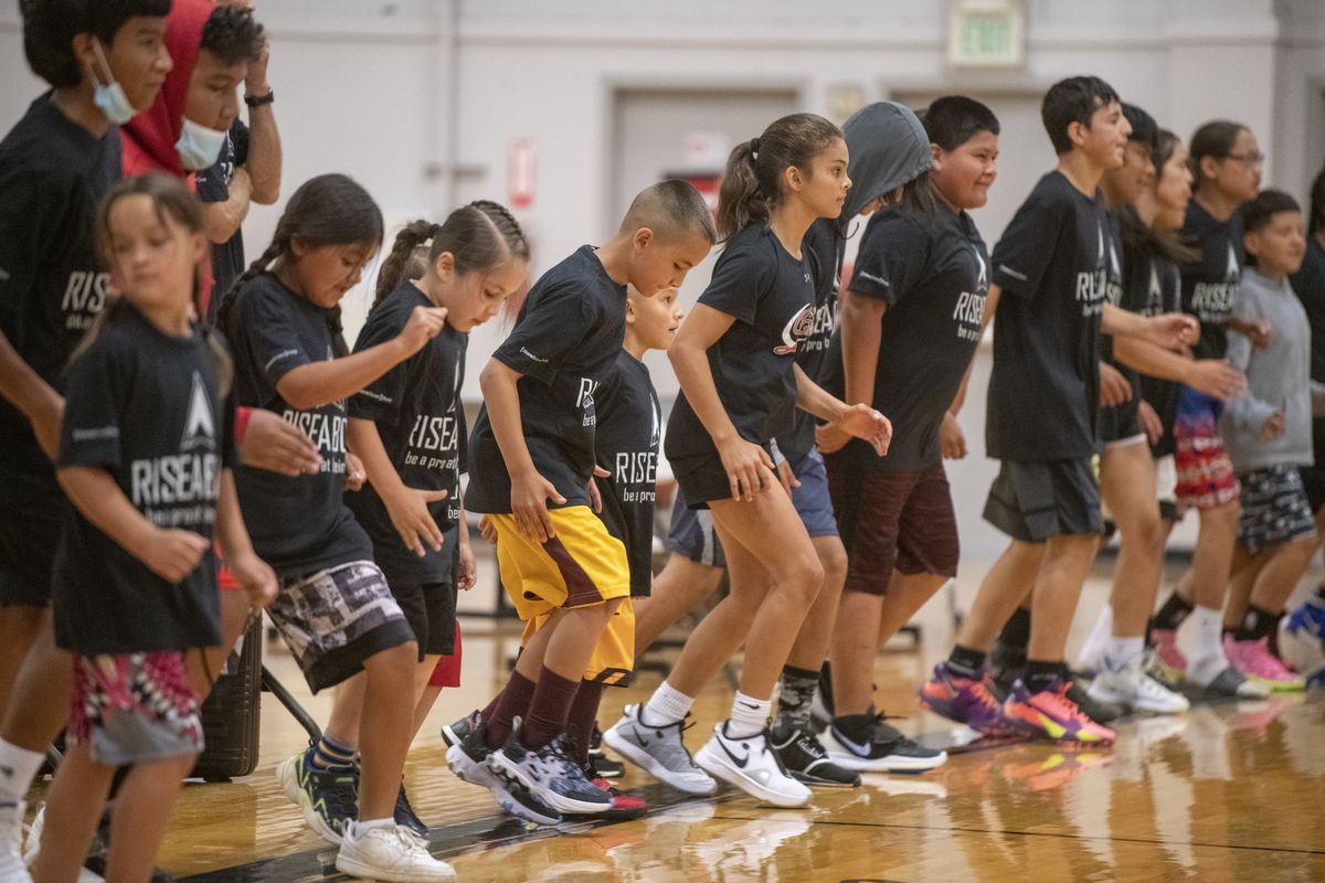 Participants in the Rise Above basketball camp at the Hub Sports Center run agility drills Monday  (Jesse Tinsley/The Spokesman-Review)