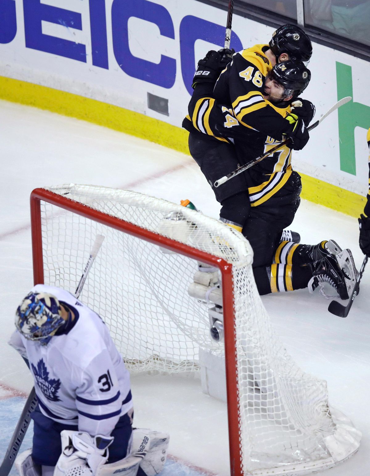 Boston Bruins left wing Jake DeBrusk is embraced by David Krejci (46) after his goal against Toronto Maple Leafs goaltender Frederik Andersen (31) during the third period of Game 7 of an NHL hockey first-round playoff series in Boston, Wednesday, April 25, 2018. (Charles Krupa / Associated Press)