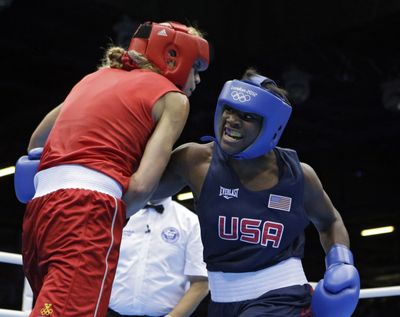 USA’s Claressa Shields, right, delivers a punch to Sweden’s Anna Laurell at London Olympics. (Associated Press)