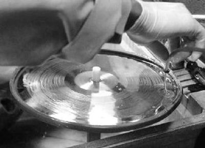 
A chemical solution is applied to a album pressing plate at the United Record Pressing plant.
 (The Spokesman-Review)