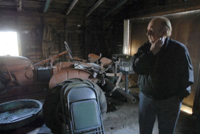 
Bert Porter looks at the 1940 Allis Chambers Model C tractor that his father used.
 (J. BART RAYNIAK / The Spokesman-Review)