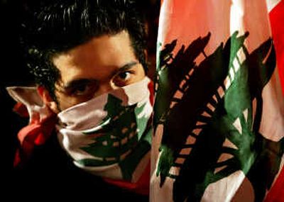 
A Lebanese youth wears a bandana of the national flag as he takes part in an anti-Syria demonstration Friday at Martyr's Square, central Beirut, Lebanon. 
 (Associated Press / The Spokesman-Review)