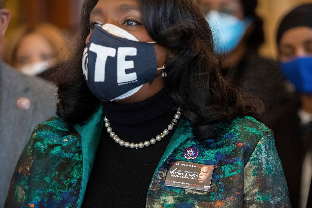 Rep. Terri Sewell, D-Ala., wears a pin honoring John Lewis while standing alongside other members of the Congressional Black Caucus speaking in front of the Senate chambers about their support of voting rights legislation at the Capitol in Washington, Wednesday, Jan. 19, 2022.  (Amanda Andrade-Rhoades)