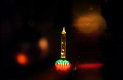 
Bubbling 1940s Christmas bulbs light a tree that Karen Hudson has adorned with vintage decorations. 
 (Brian Plonka photos/ / The Spokesman-Review)