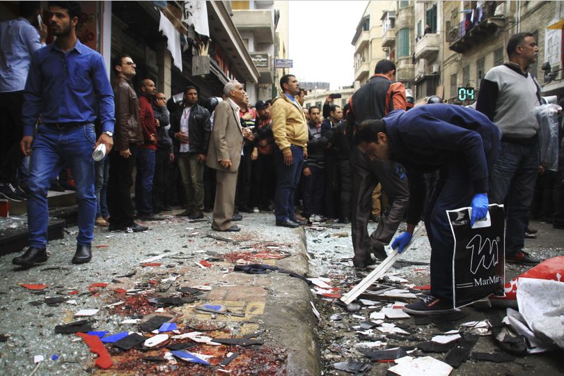 People clean up debris after an explosion hit Saint Mark's Cathedral in the coastal city of Alexandria, the historic seat of Christendom in Egypt, Sunday, killing several people, just after Pope Tawadros II finished services. Bombs tore through two Egyptian churches in different cities as worshippers were marking Palm Sunday, both claimed by the Islamic State group. (Hazem Gouda / Associated Press)