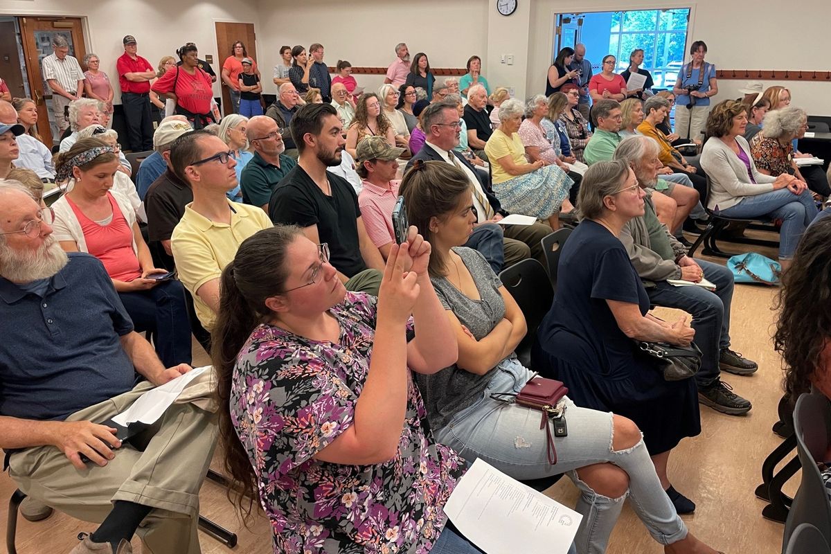 Attendees at a July 10 meeting of the Samuels Public Library board in Front Royal, Virginia, discuss removing books that some find objectionable.  (Gregory S. Schneider/Washington Post)
