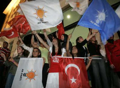 
Justice and Development Party supporters wave Turkish and party flags outside party headquarters in Ankara late Sunday. Associated Press
 (Associated Press / The Spokesman-Review)