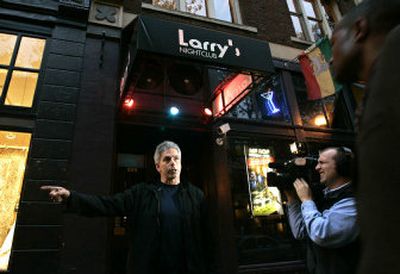 
Larry Culp, owner of Larry's Nightclub in the Pioneer Square neighborhood of Seattle is interviewed by local news about an assault involving Seahawks player Ken Hamlin. 
 (Associated Press / The Spokesman-Review)