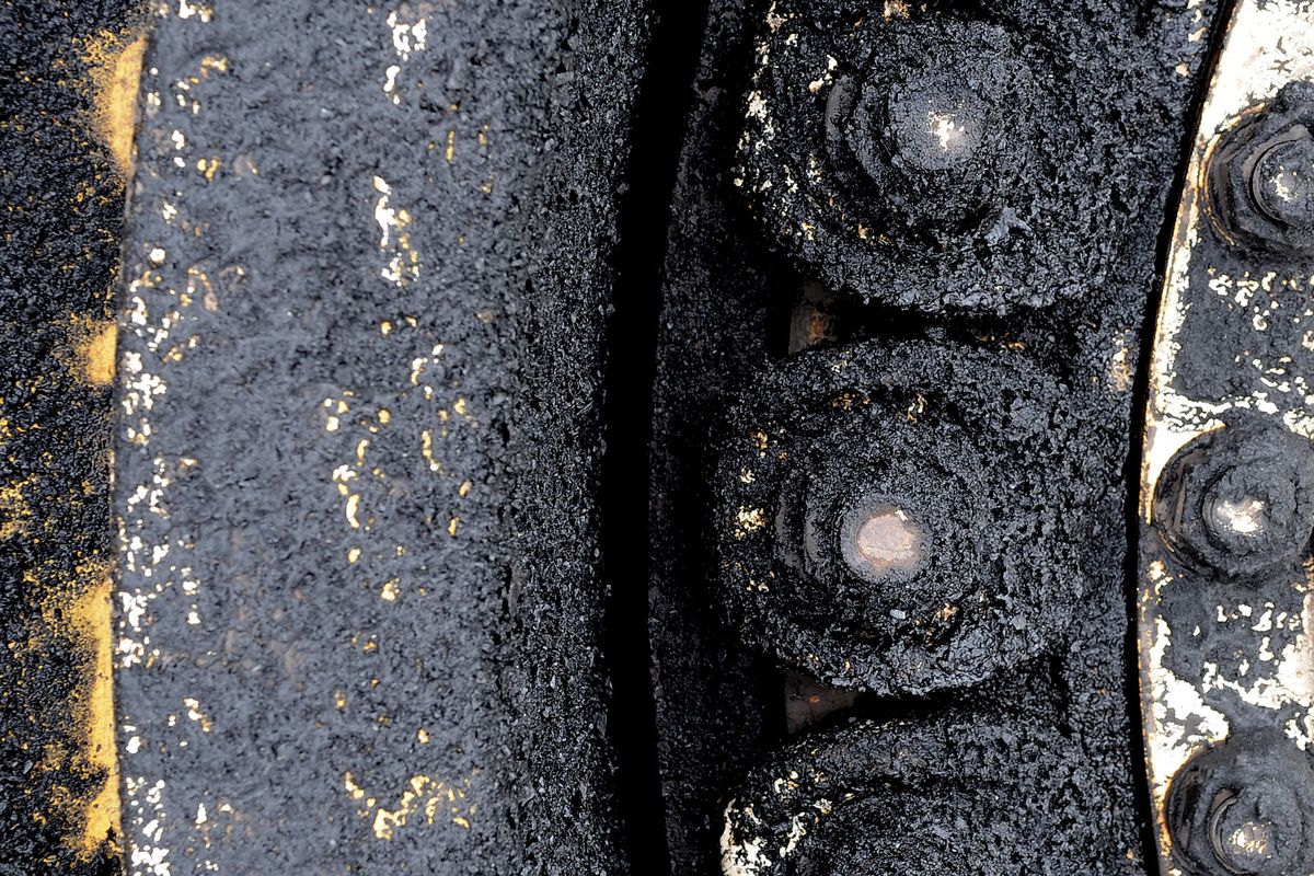 Bits of coal cling to the 10-foot-tall tires of a 200-ton Kress coal-hauler at the Rosebud Mine in Colstrip, Mont.