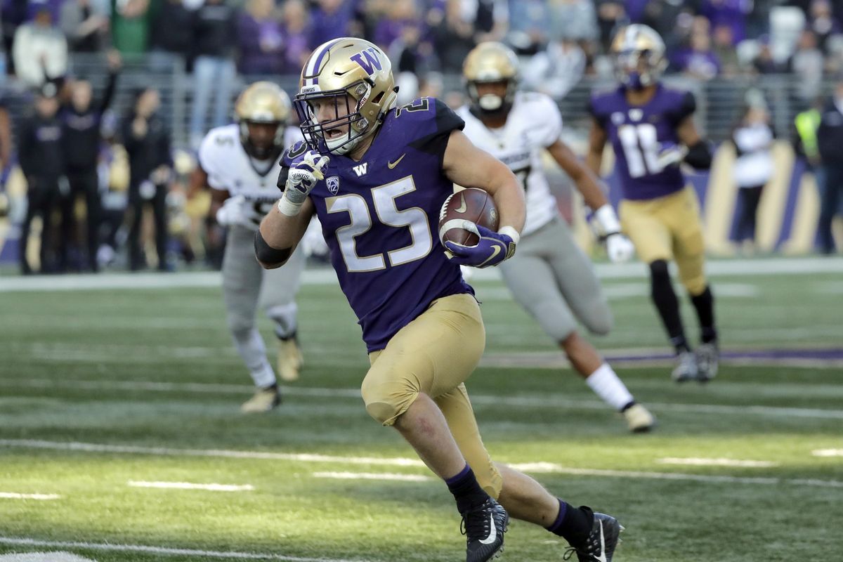 Washington linebacker Ben Burr-Kirven (25) runs after he intercepted a pass thrown by Colorado quarterback Steven Montez during the second half of an NCAA college football game, Saturday, Oct. 20, 2018, in Seattle. Washington won 27-13. (Ted S. Warren / AP)