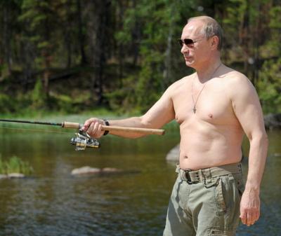 In this photo taken on Saturday, July 20, 2013, Russian President Vladimir Putin fishes during a mini-break in the Siberian Tyva region (also referred to as Tuva), Russia. (AP Photo/RIA-Novosti, Alexei Nikolsky, Presidential Press Service)